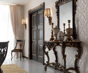 The dark wooden door in classic Baroque style perfectly complements the Vintage style of the interior