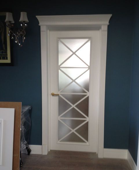 White wooden interior doors with white door frame