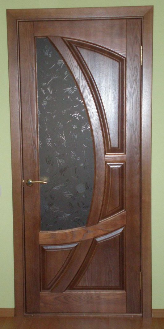 Hinged wooden door in the apartment