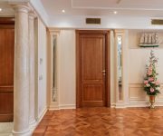 The massive door of solid wood in a classic room design
