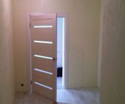 White interior doors in a bright room during the renovation