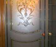 Luxurious glass interior door with vintage patterns