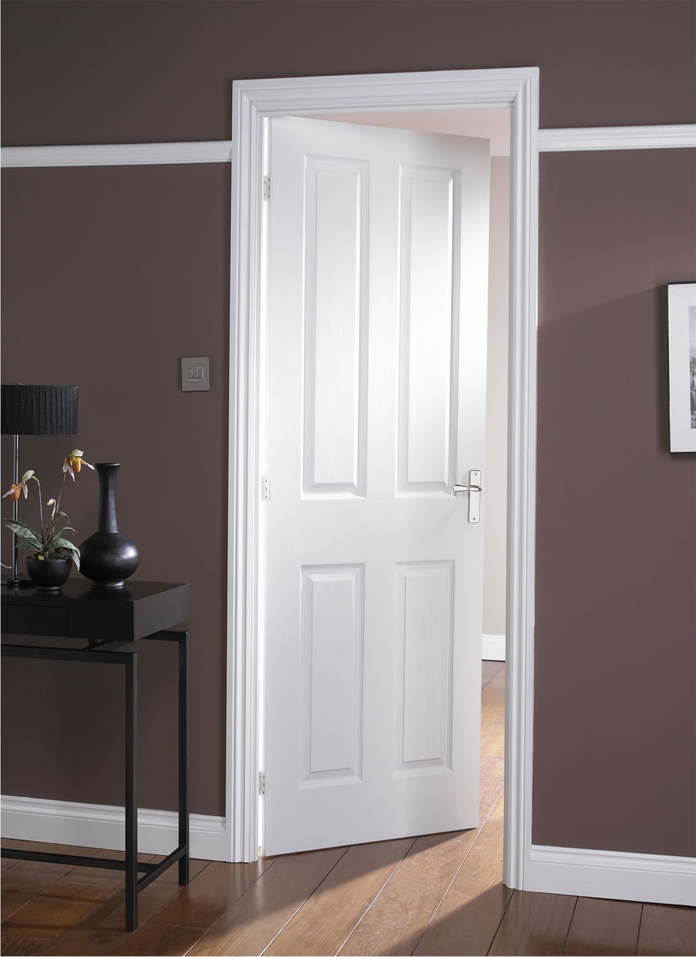 White interior masonite door to a dark room