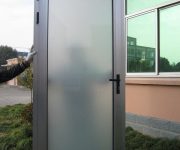 Aluminum door with white opaque frosted glass before installing