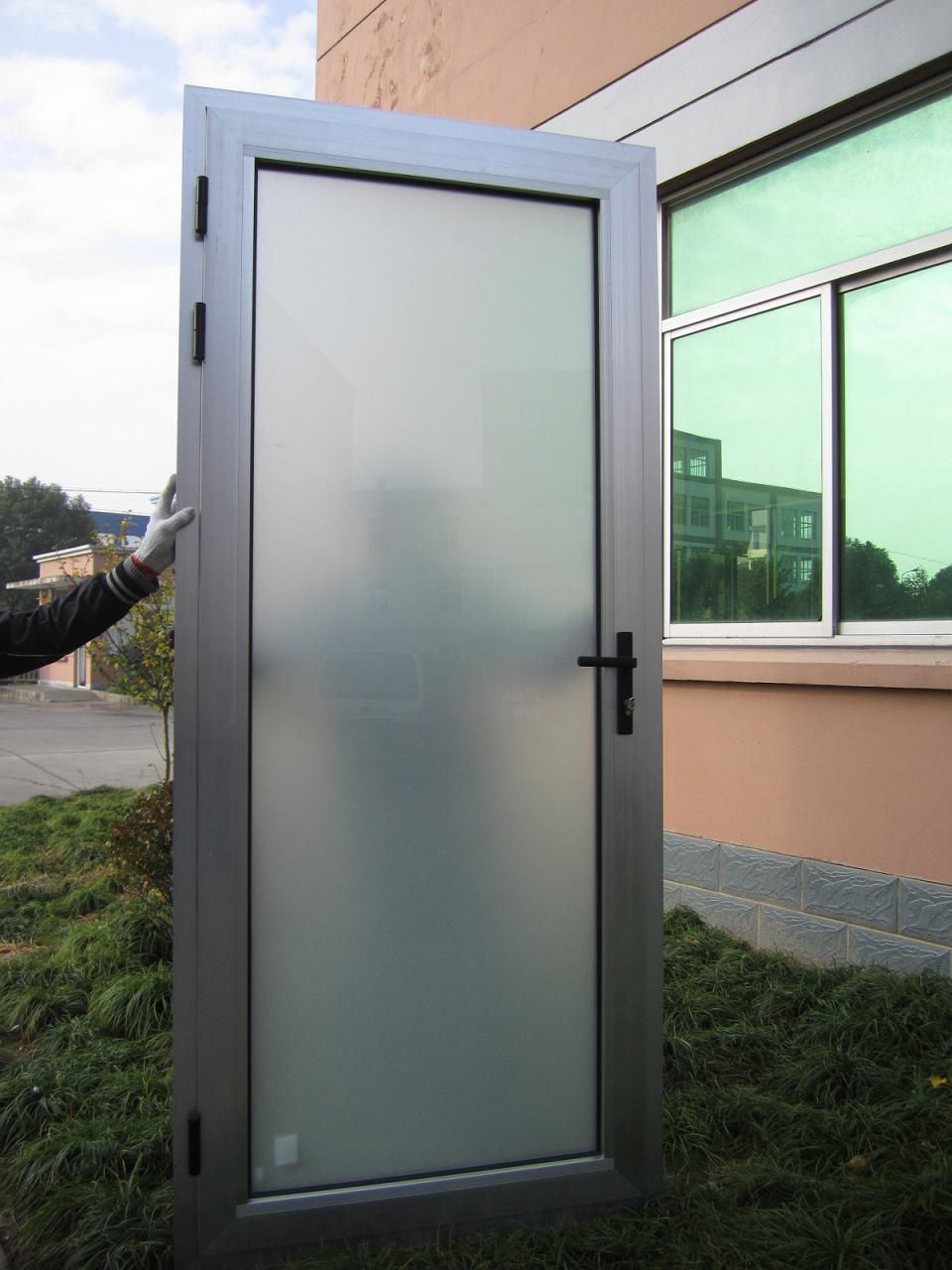 Aluminum door with white opaque frosted glass before installing