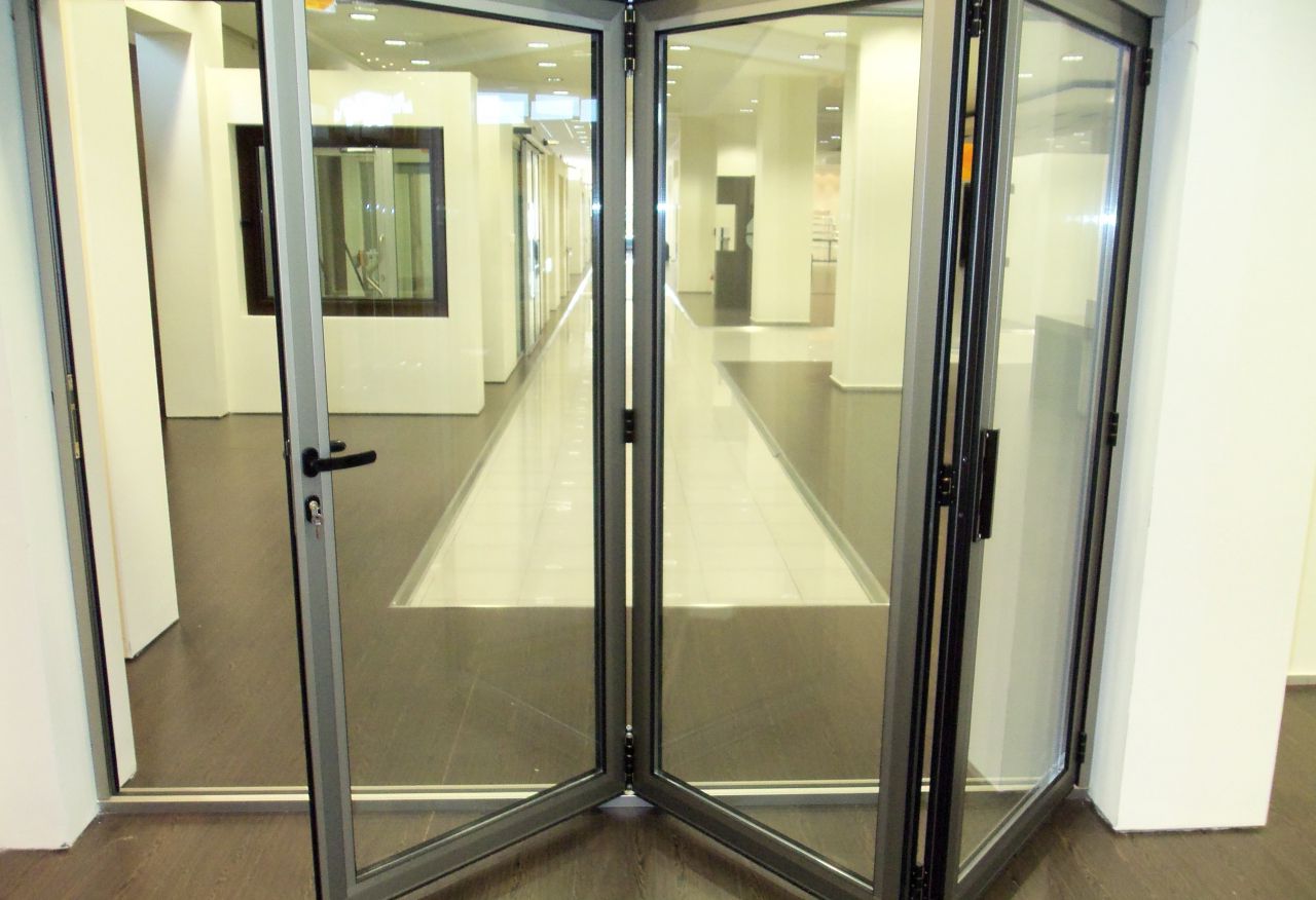 Folding interior aluminum door with glass