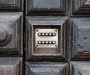 Combination lock on vintage wooden door