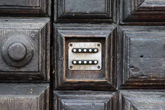 Combination lock on vintage wooden door