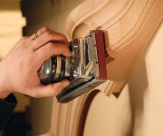 Sanding wooden door before applying the stain