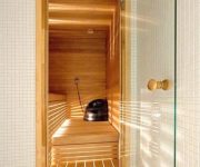 Hinged glass door for saunas