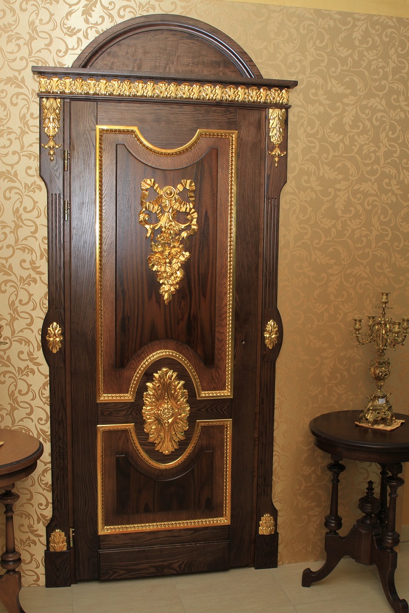 Carved oak doors with gold