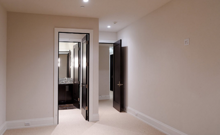 Interior design with black doors and white walls and white floors 728x449 - Interior with Dark Doors and Light Floor