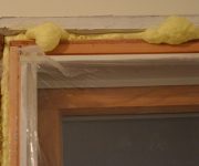 The foaming of the door frame.