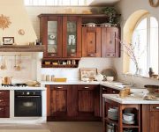 Cabinets made of natural wood in the kitchen in the Italian style