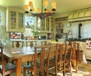 Ceiling lamps in vintage style and wooden furniture – Italian kitchen interior