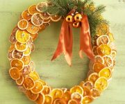 Christmas wreath made of spruce and citrus with Christmas balls