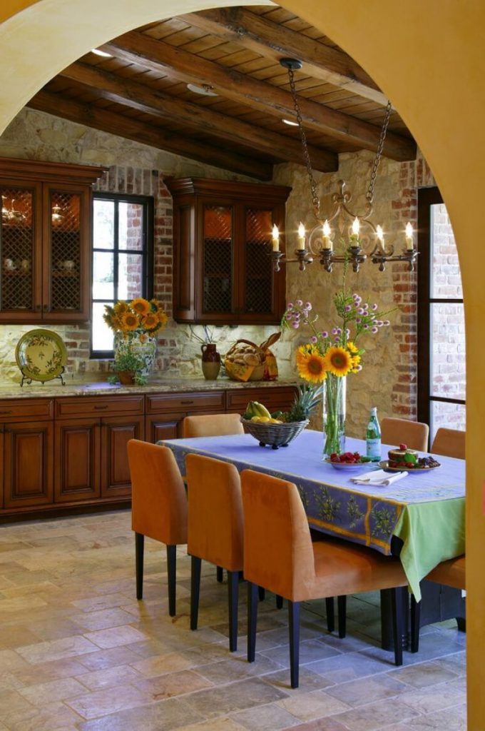 Lighting in the kitchen in the Italian style Stylized antique chandeliers 680x1024 - Italian Kitchen Decor - the charm of tradition