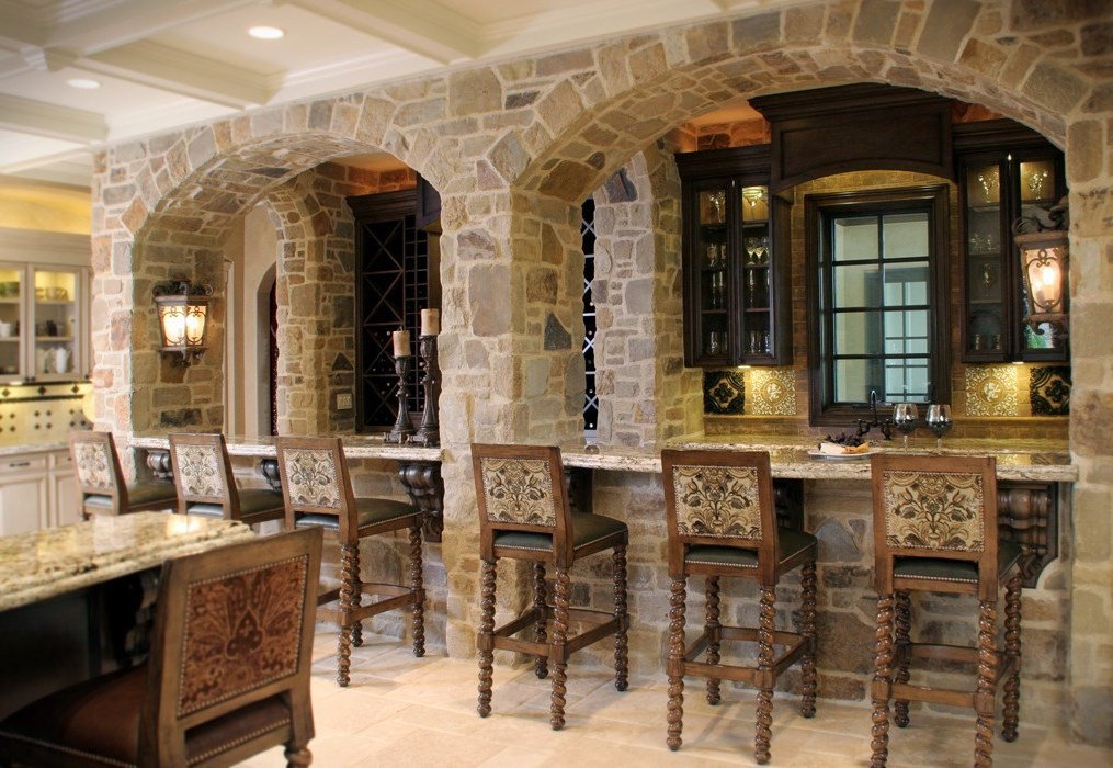 Kitchen medieval style – stone archways and antique furniture