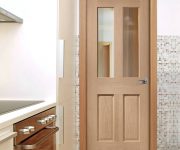 Oak glazed fire doors design in kitchen