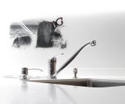 Chrome faucet in kitchen high tech style 180x150 - High-Tech Kitchen