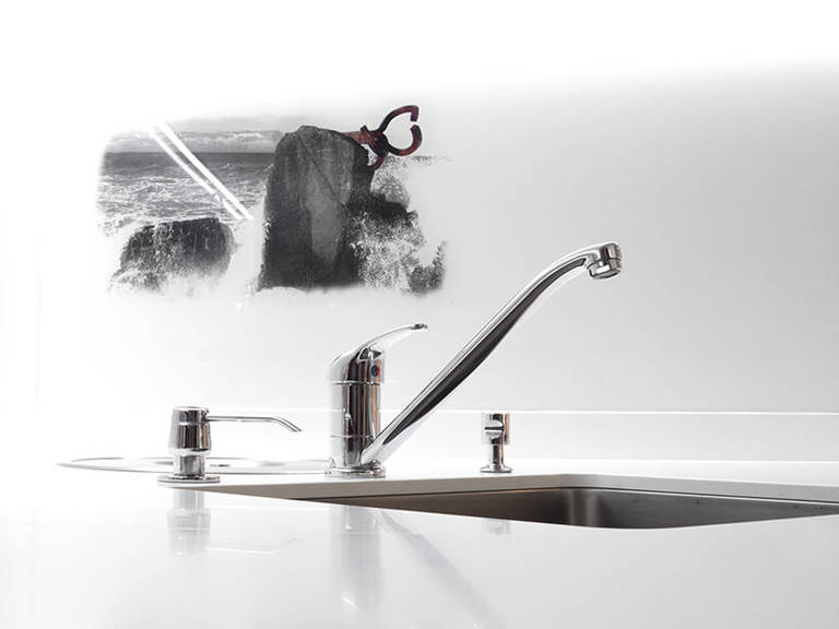 Chrome faucet in kitchen high-tech style