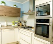 Kitchen High Tech Style Wooden facades of light shades soften this strict style 180x150 - High-Tech Kitchen