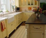 Lighting and cabinets warm colors in the kitchen in country style 180x150 - Country-Style Kitchens