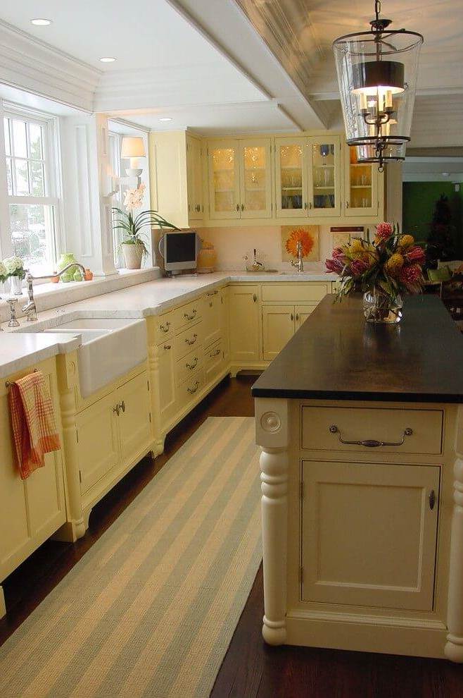 Lighting and cabinets warm colors in the kitchen in country style