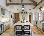 Whitewashed ceiling in the country style kitchen