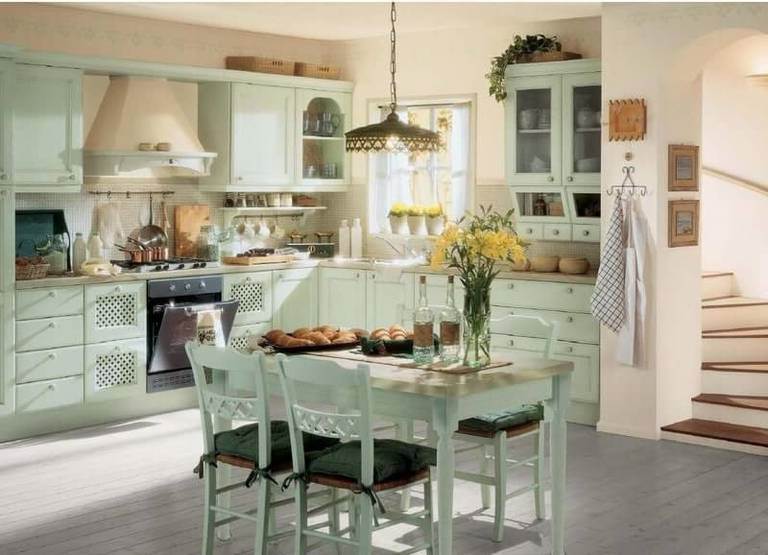 Wooden dining table, white wardrobes and chairs – kitchen furniture in country style