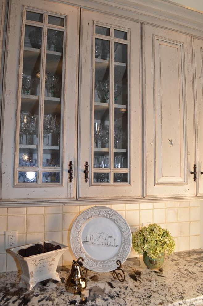 Wooden kitchen cupboard with glasses for dishes